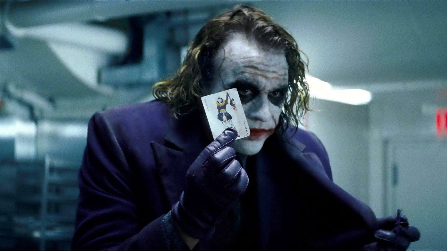 The Dark Knight | Still features Heath Ledger as the Joker holding up his card.