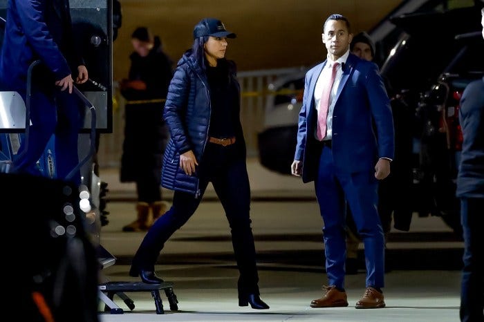 Tulsi Gabbard, US director of national intelligence, and another official stand outside the Fulton County Department of Registration and Elections.