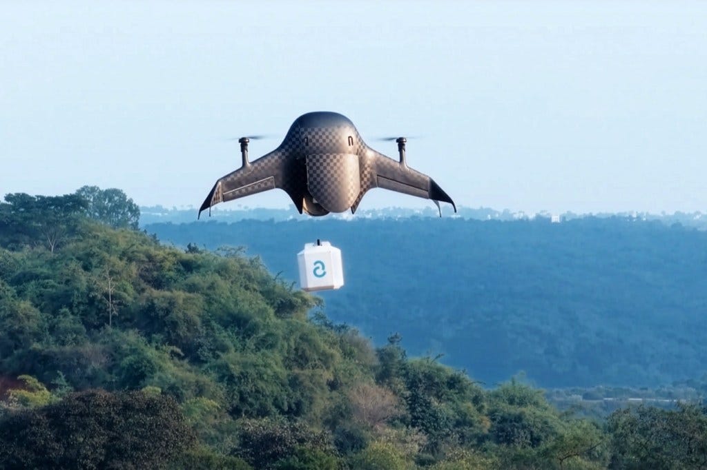 Airbound drone in flight carrying payload