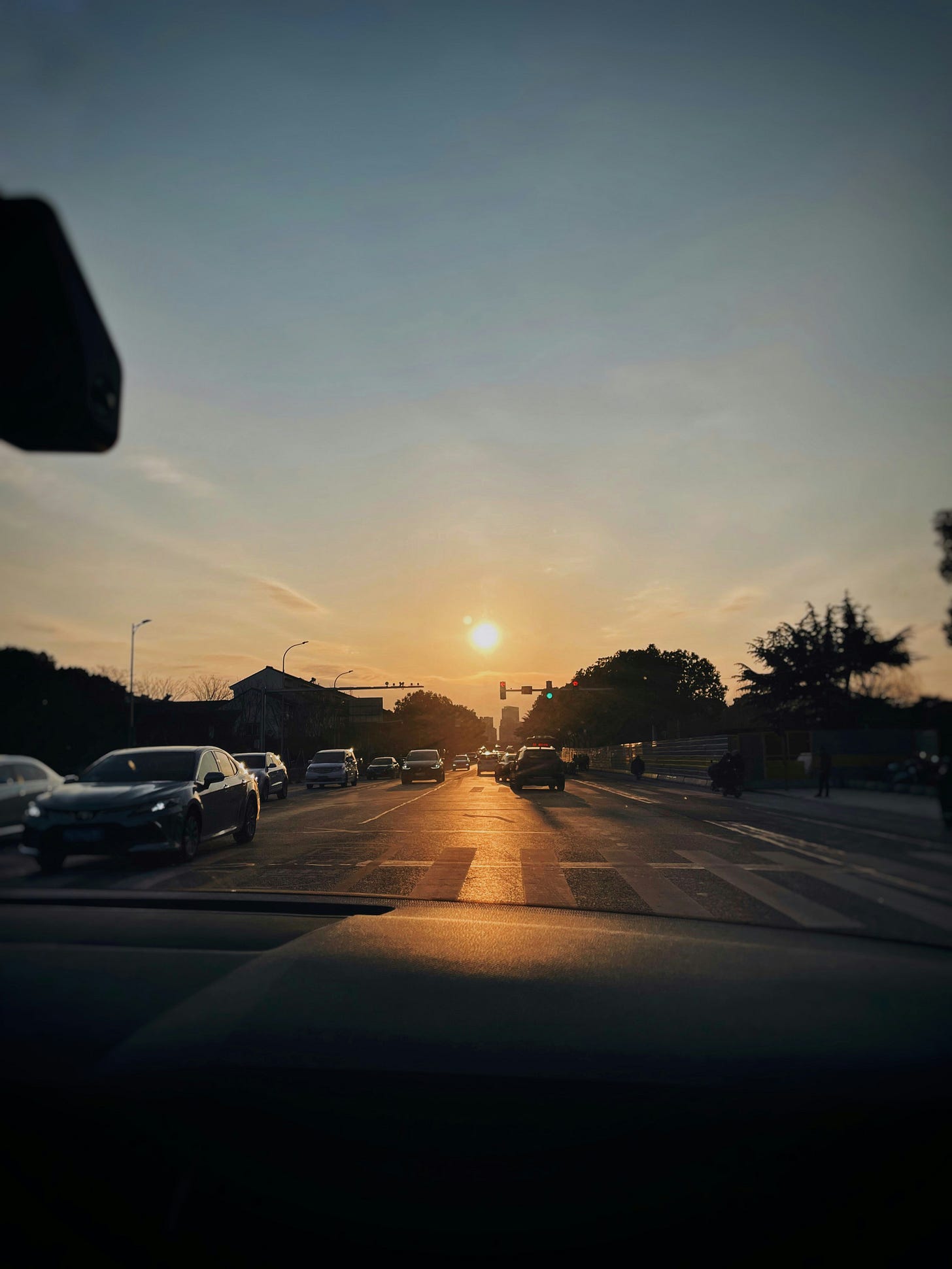 First person perspective of a driver on a busy street. First person perspective of a driver on a busy street.
