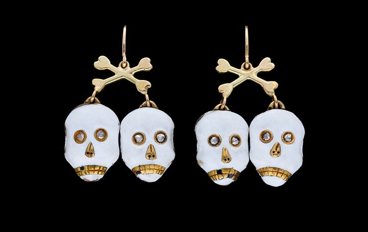 Gold and ruby salamander bracelet. Gold and enamel skull earrings