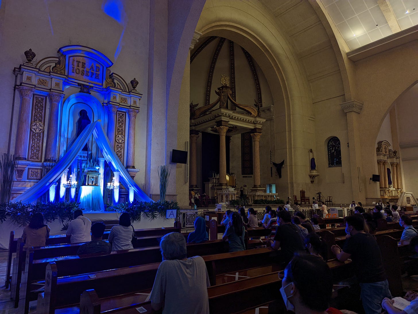 The altar of repose of Our Lady of Mount Carmel lit by blue lighting