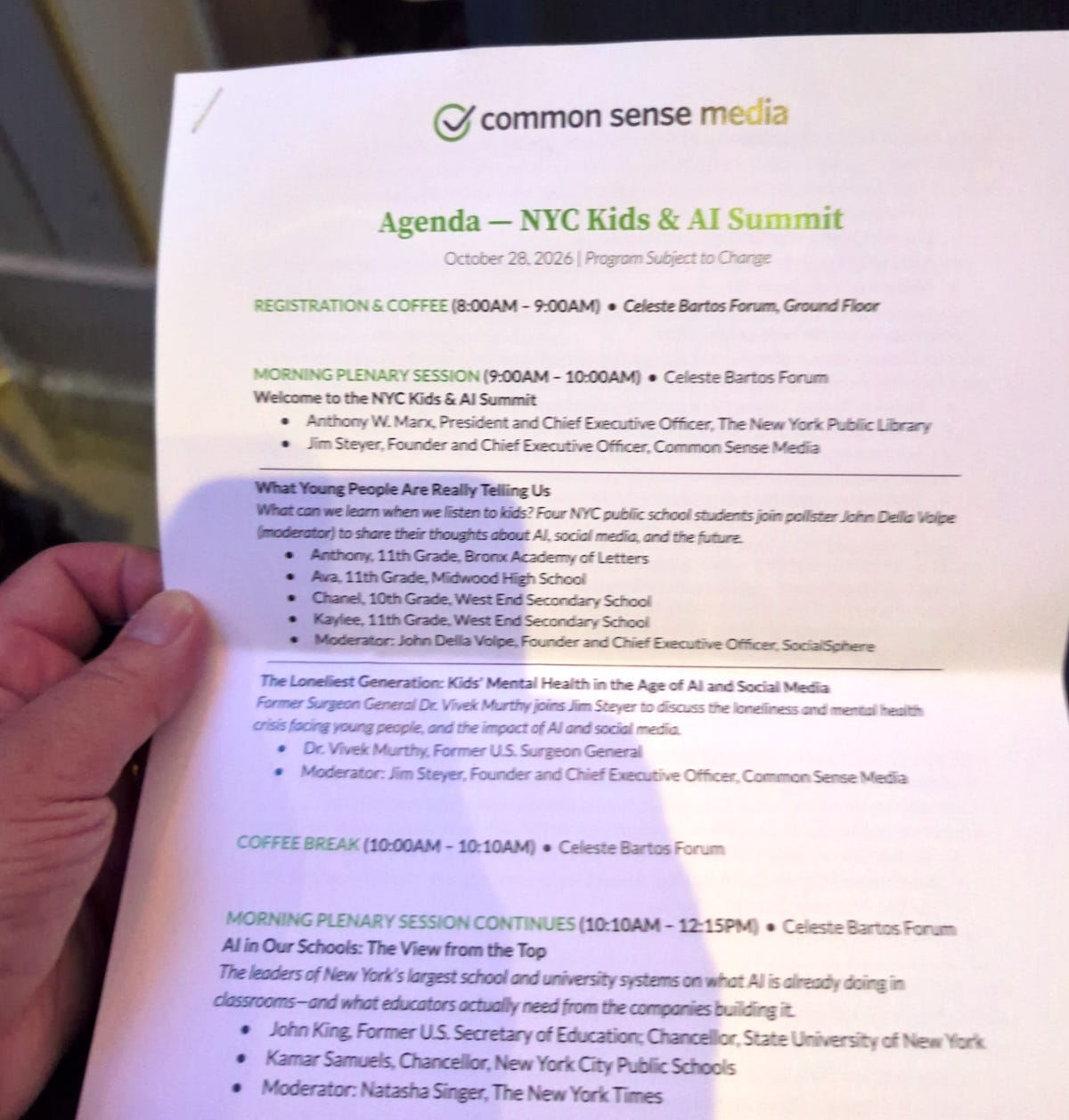 Natalya Murakhver holds the printed agenda for the NYC Kids & AI Summit Natalya Murakhver holds the printed agenda for the NYC Kids & AI Summit
