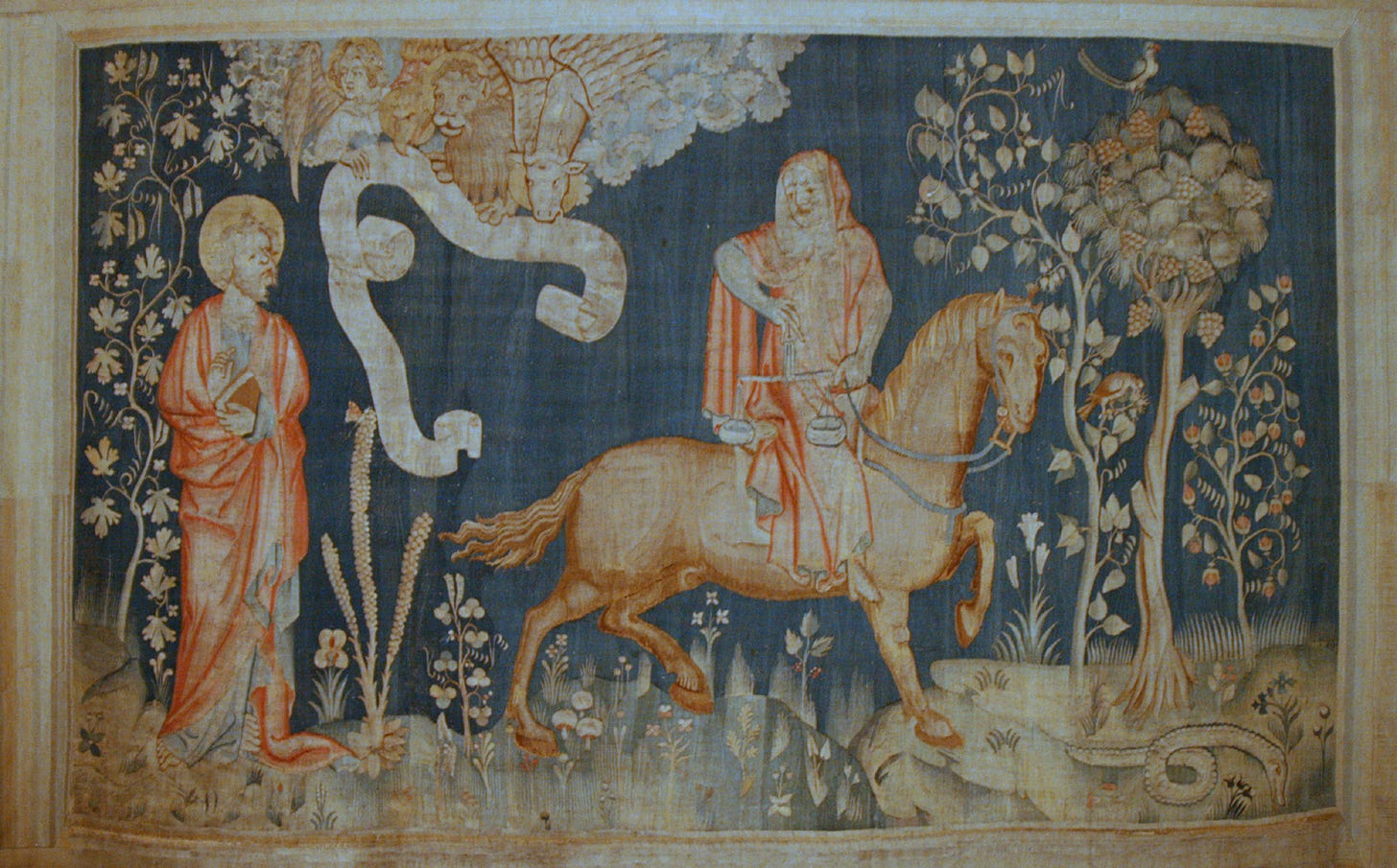 A section of a medieval tapestry on a deep blue and red ground, showing a rider on horseback from the Book of Revelation, framed by a woven border.