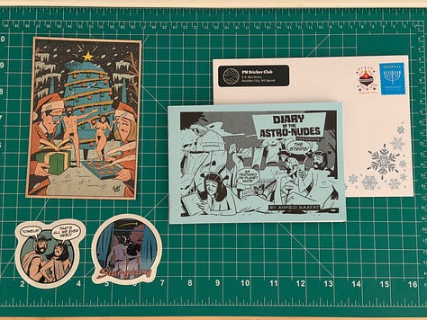 Three Planet Nude Sticker Club mailings laid out on a table, showing a mix of illustrated nudist-themed stickers, printed inserts, and zine-style extras from different monthly drops.