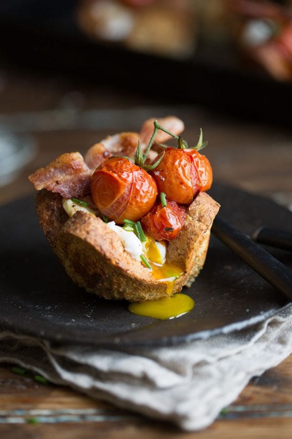 poached egg and bacon in bread baskets