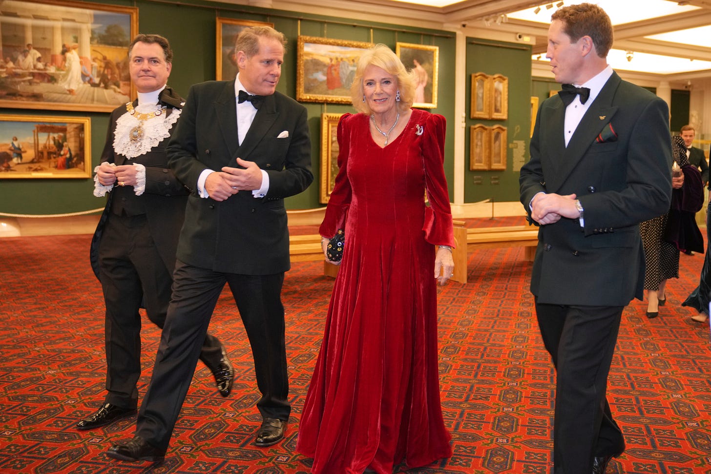 Camilla in a red dress