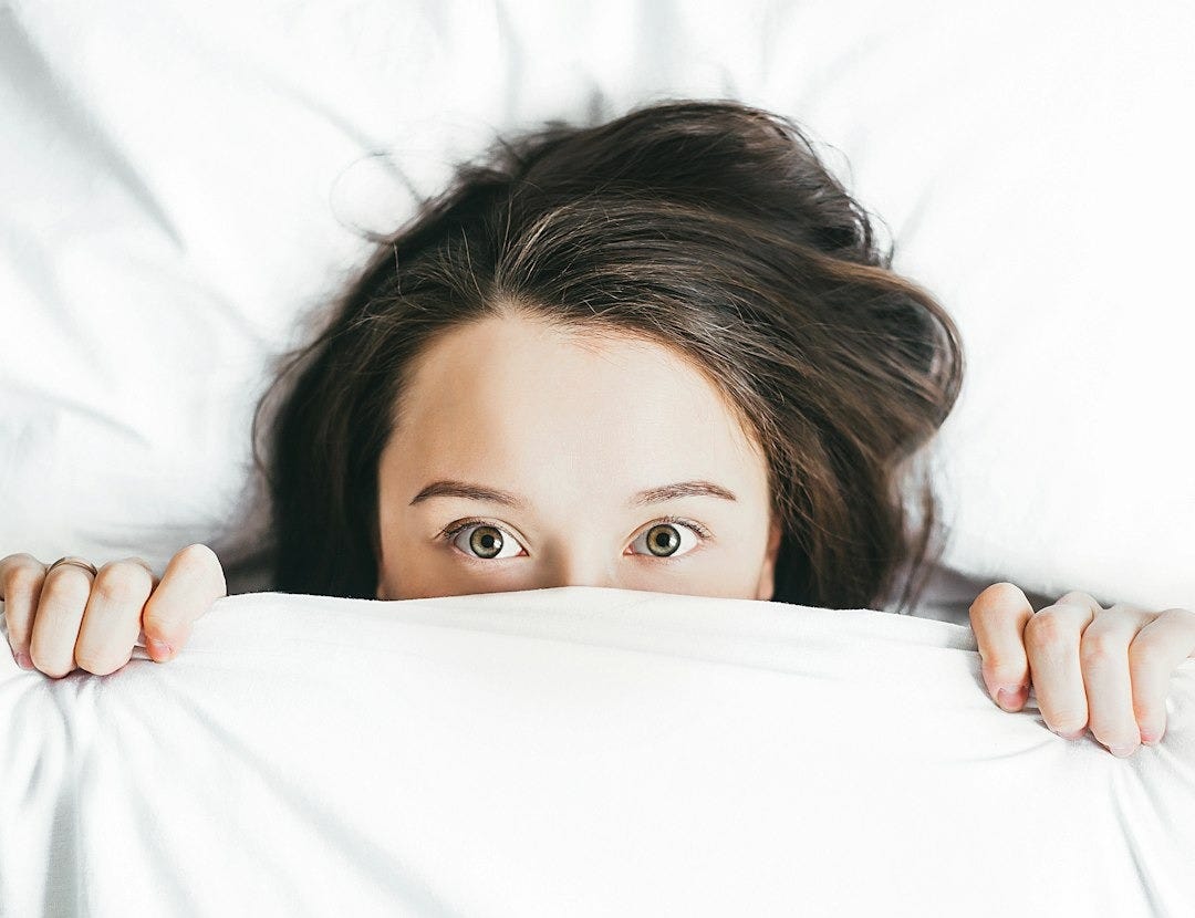 woman covering her face with blanket woman covering her face with blanket