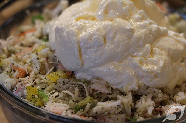 Showing the mayonnaise added to the bowl. Showing the mayonnaise added to the bowl.