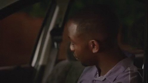 a man is sitting in the back seat of a car and smiling a man is sitting in the back seat of a car and smiling