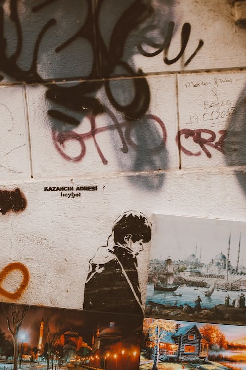 Free Paintings on White Wall with Graffiti Stock Photo Free Paintings on White Wall with Graffiti Stock Photo
