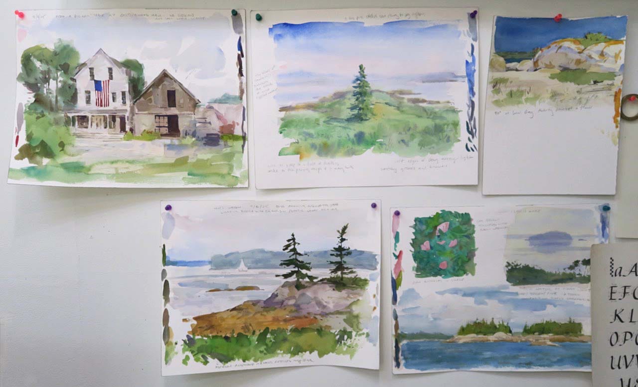 A group of watercolor paintings on a wall

Description automatically generated