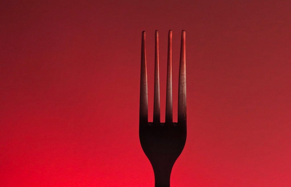 fork on a red background. "fork" by Dean Hochman is licensed under CC BY 2.0.