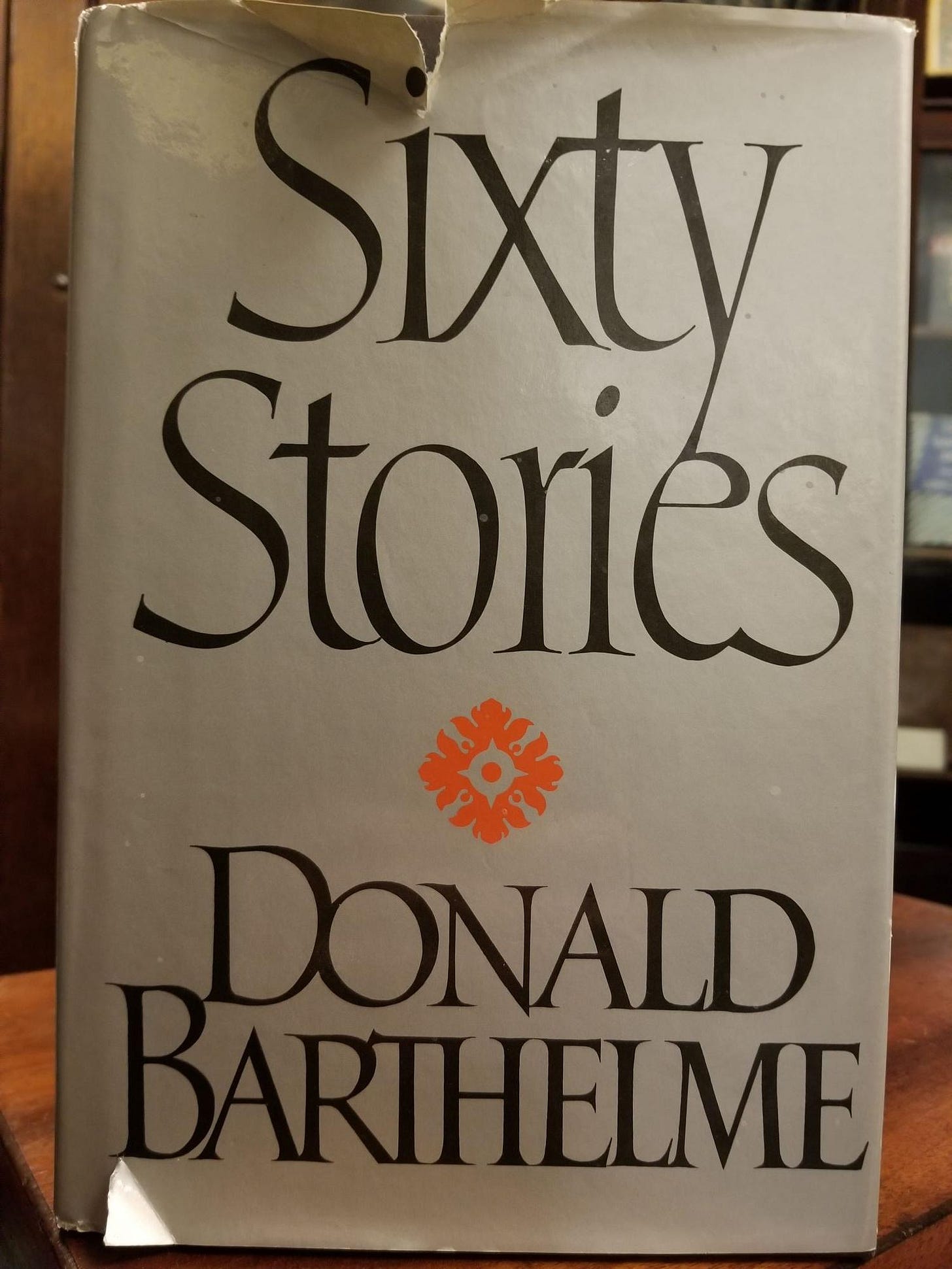 Cover of Sixty Stories by Donlad Barthelme, with slightly torn dust jacket