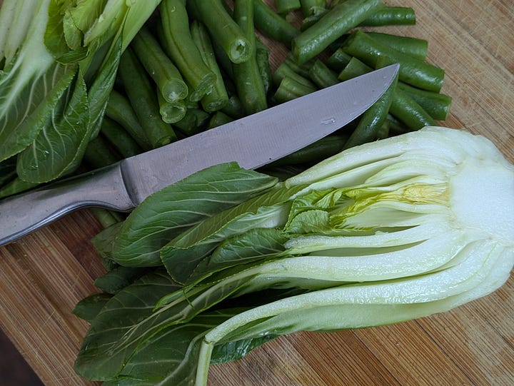 Finished stir-fry with chicken. Bok choy and green beans before cooking.