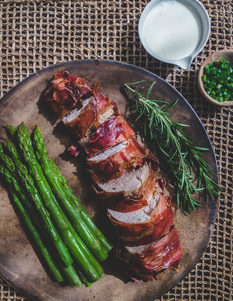pork tenderloin wrapped with bayonne ham with asparagus
