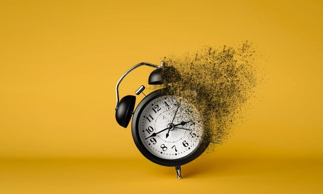 A black alarm clock dissolving on yellow background. Concept of importance of moments conveying time running out. A black alarm clock dissolving on yellow background. Concept of importance of moments conveying time running out.