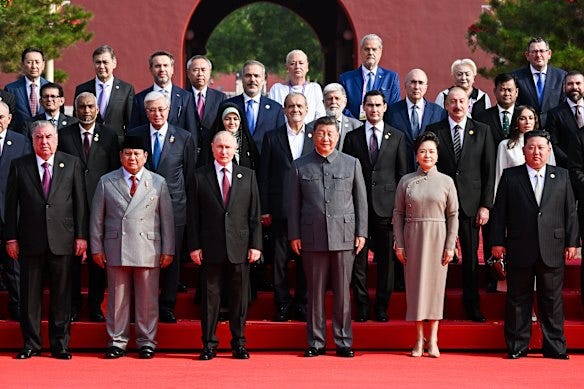 Former Victorian premier Dan Andrews, top right, posing behind Kim Jong-un, Xi Jinping and Vladimir Putin before the parade.
