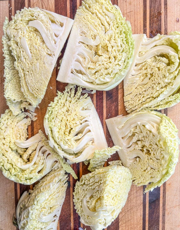 Try this Maple Bacon Cabbage recipe! Roasted cabbage wedges with crispy bacon and a homemade maple Dijon dressing. Easy, flavorful, gluten-free side dish for fall dinners, Thanksgiving, or meal prep. #vegetableside #cabbagerecipes #shutterbean