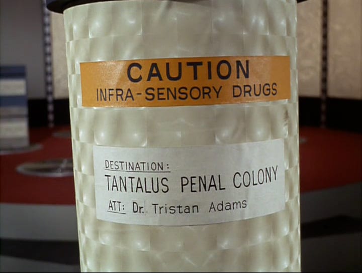 The canister is labelled: CAUTION INFRA-SENSORY DRUGS DESTINATION: TANTALUS PENAL COLONY ATT: Dr. Tristan Adams