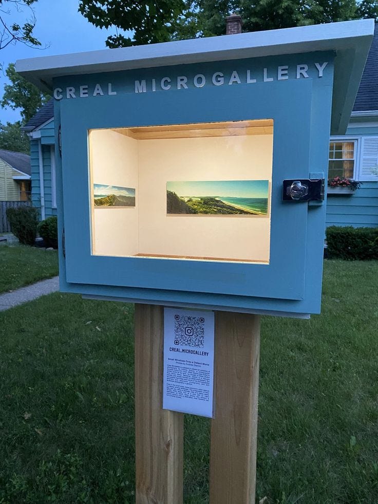 This may contain: a blue box sitting on top of a wooden post