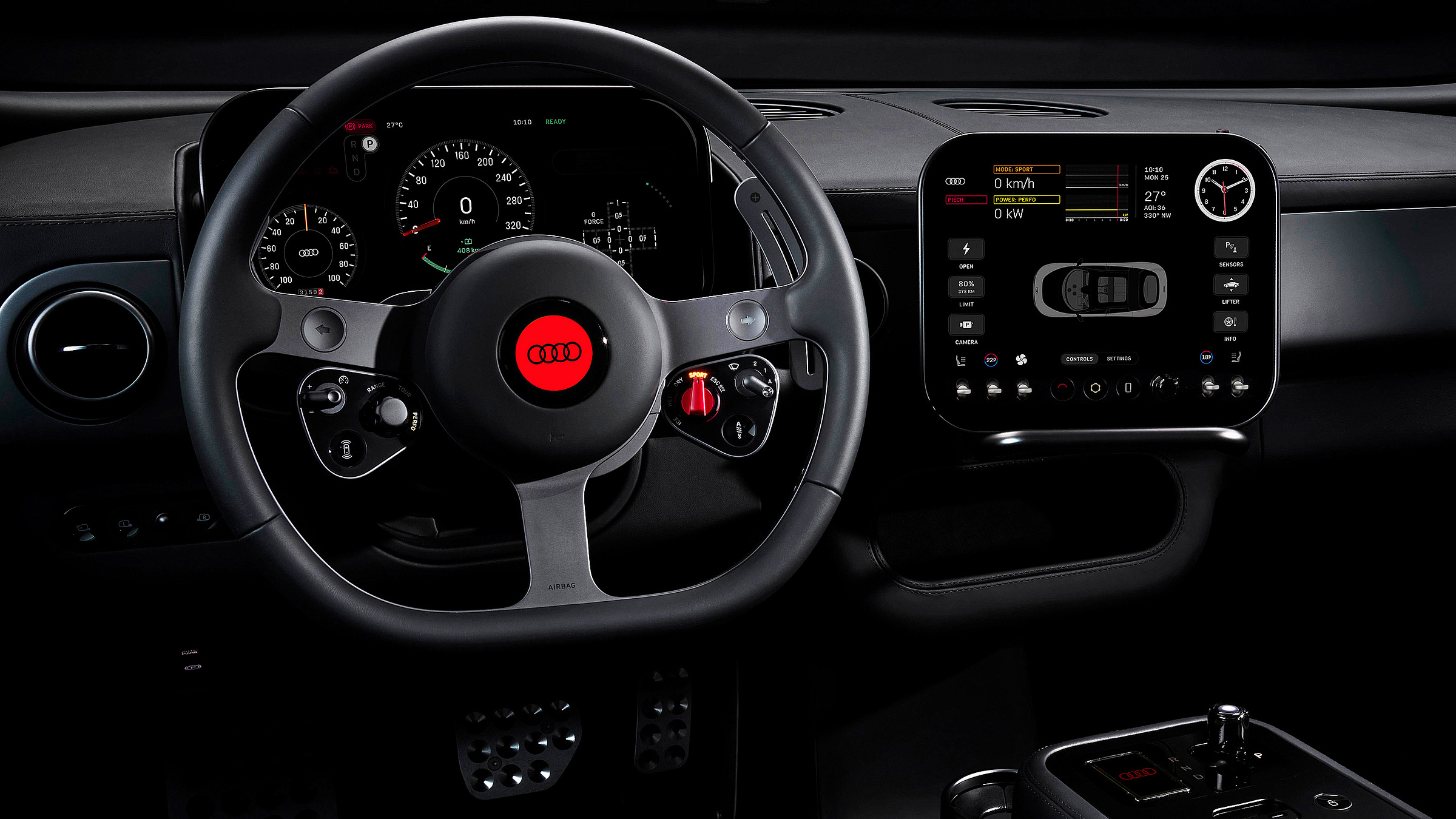 The interior of the Ferrari Luce retouched to replace Ferrari branding with Audi's four-ring logo. A round, three-spoke racing-style steering wheel with a red Audi logo centre dominates the foreground, flanked by analogue instrument dials behind. To the right, a separate portrait-oriented touchscreen displays vehicle data including speed, power output, and a top-down car graphic. The interior is finished entirely in dark grey and black, with a red ignition-style switch visible on the steering column. Metal pedals and a gear selector are visible in the lower frame.