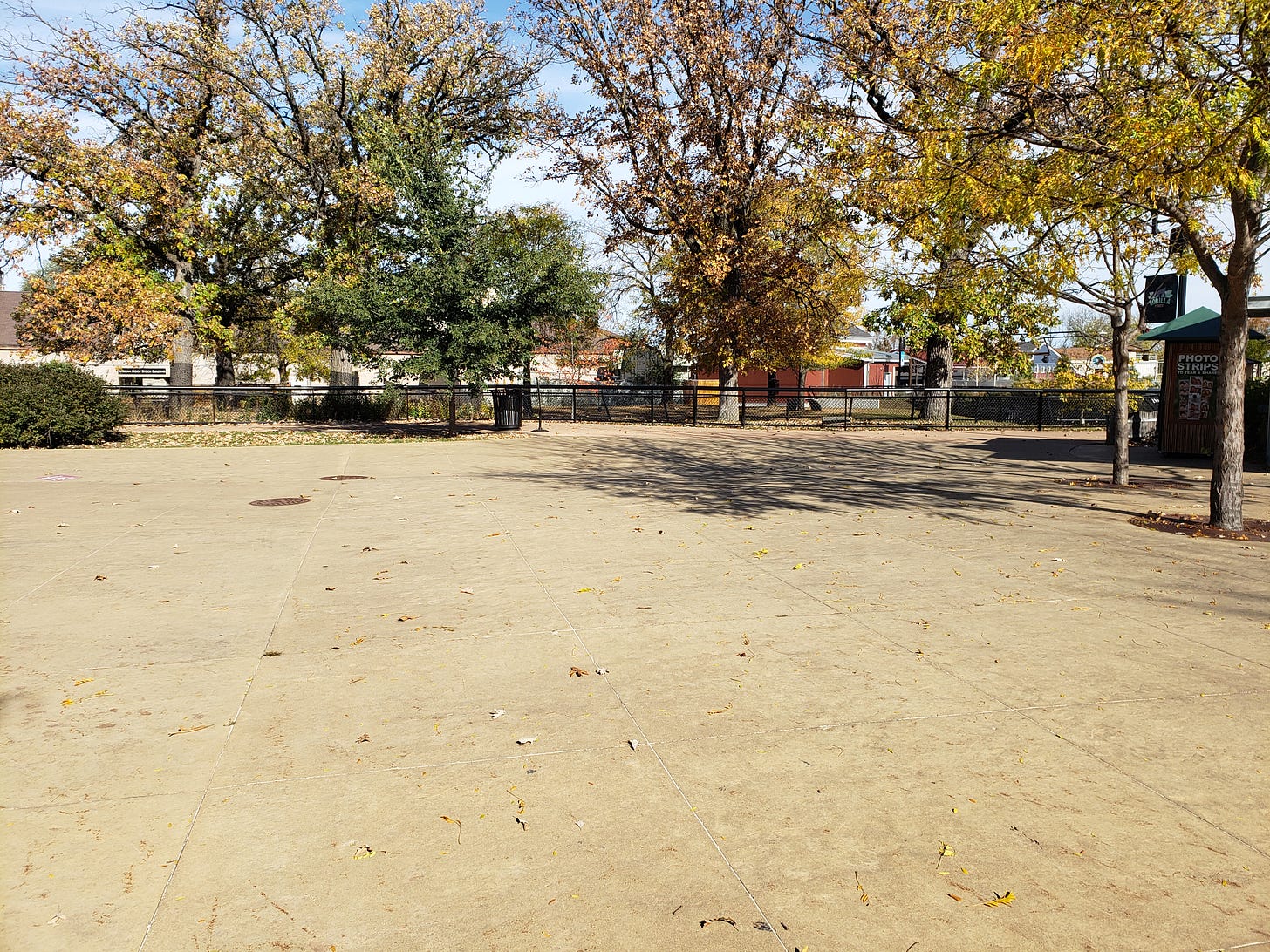 An empty plaza at Como zoo. There is not a person anywhere in the image.