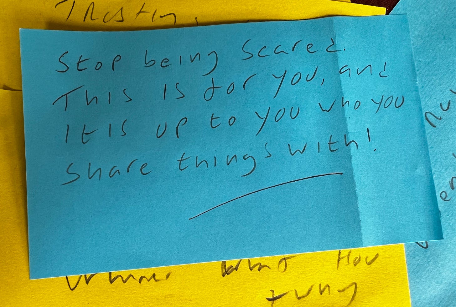 Post-it with the words 'Stop being scared. This is for you, and it is up to you who you share things with'