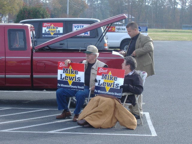 Mr. and Mrs. Lewis campaigning for their son. Mr. and Mrs. Lewis campaigning for their son.
