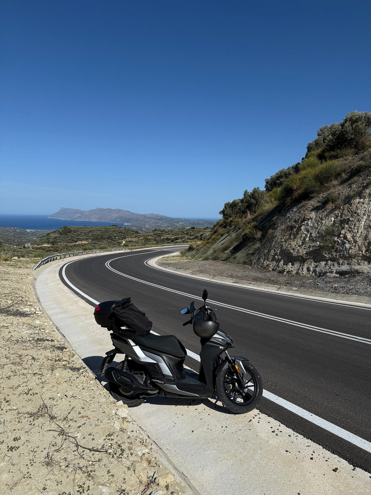 50km from the city, standing on the hill at +30∘C, with a rental scooter that has a check engine light on