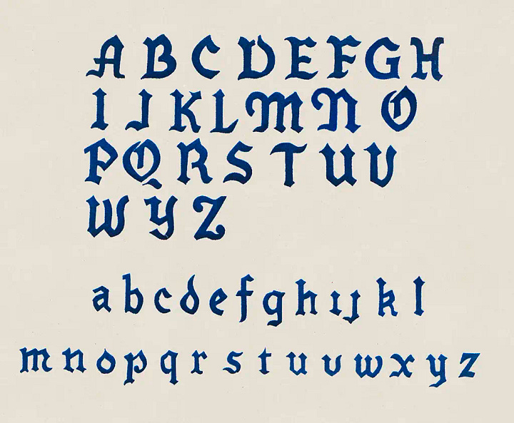 collection of velvet flocked alphabets on cream paper background