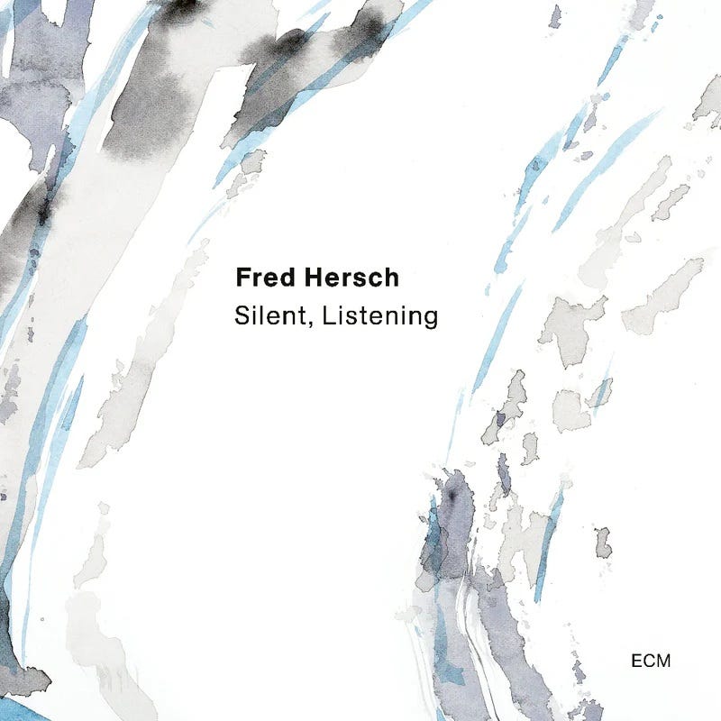 Cover image of album "Silent, Listening," by pianist Fred Hersch, featuring album title and artist name on a background of abstract watercolor painting