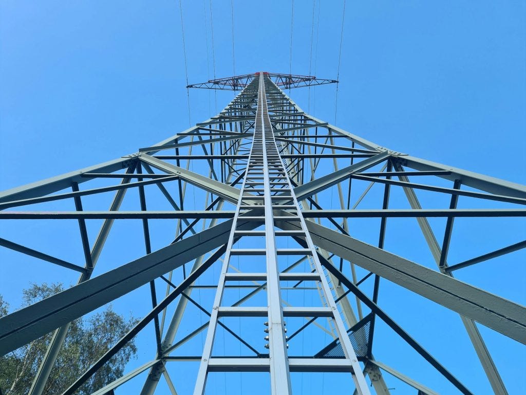 Power pylon as the AI Energy Council gathers aiming to address the question of how to power artificial intelligence without blowing the grid as the massive data centres needed to train and run the latest AI are thirsty for electricity.