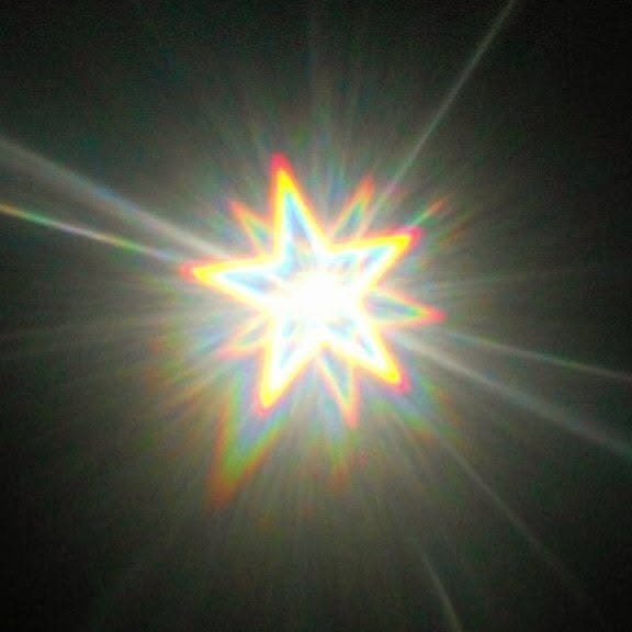 This may contain: the sun is shining brightly in the dark sky This may contain: the sun is shining brightly in the dark sky