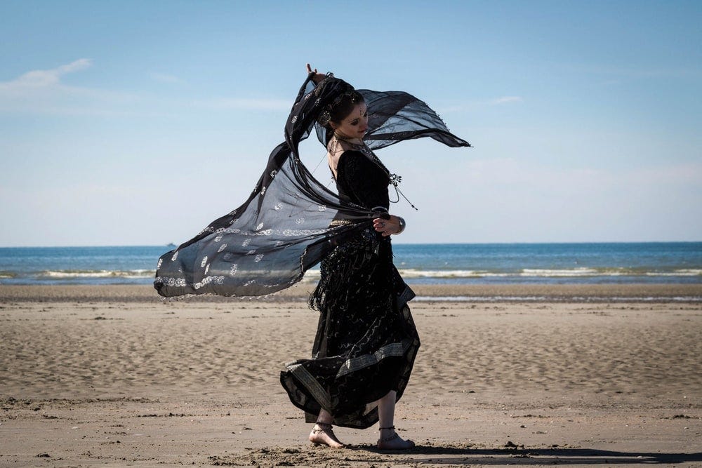 woman dancing on seashore woman dancing on seashore
