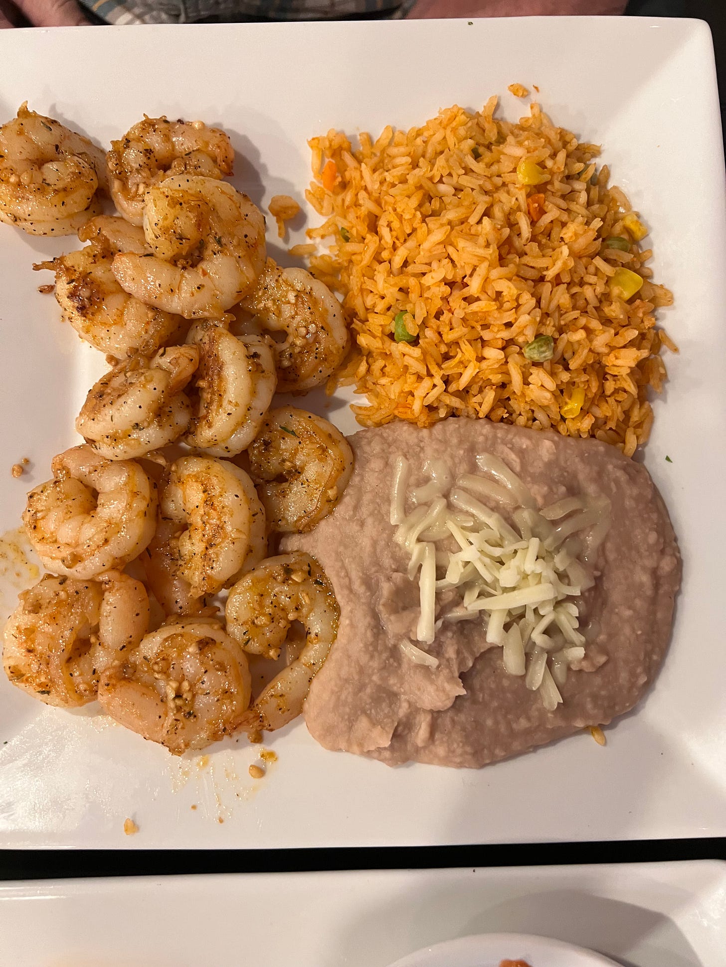 Cameron al mojo de ago grilled shrimp Mexican rice and refried beans