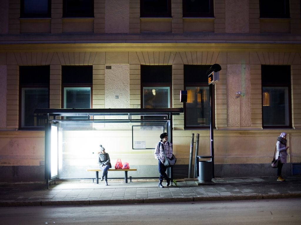 Image may contain Human Person Bus Stop Pedestrian and Door