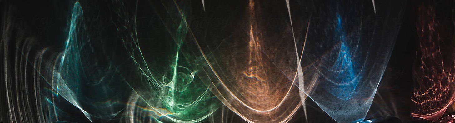 Colorful reflections of light on paper by Robert Kohlhuber for Stocksy United