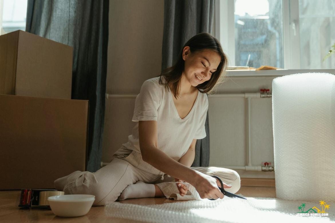 woman in white crew neck t shirt sitting on bed