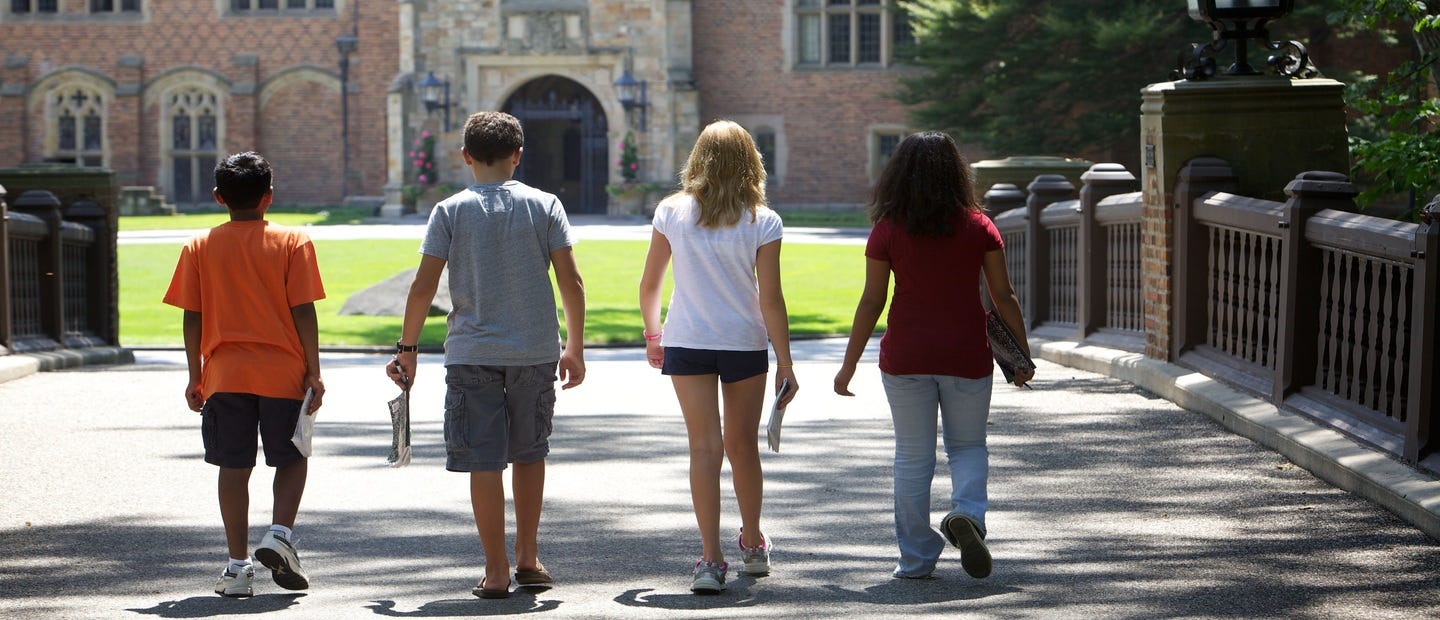 kids walking on Oakland University Campus