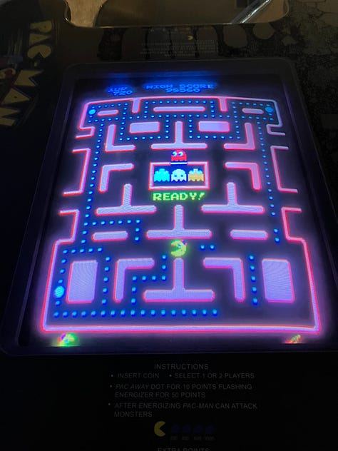 Ping pong, pool, Pac-Man, TV entertainment center, and dart board