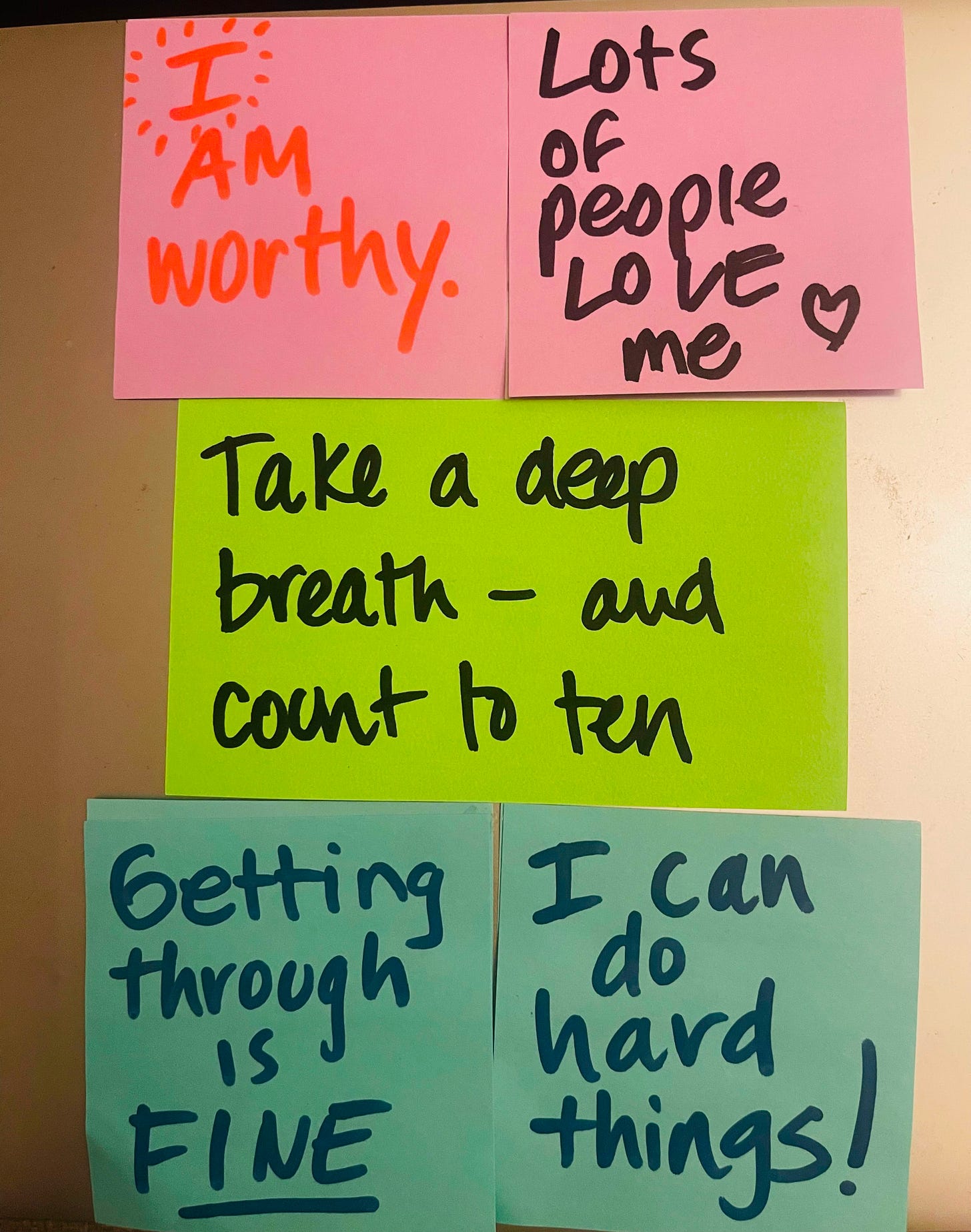 The Post-its say: I am worthy, Lots of people love me; Take a deep breath and count to ten; Getting through is fine; I can do hard things.