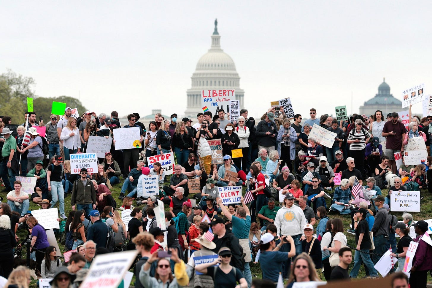 WASHINGTON, DC - APRIL 05: Protesters attend a "Hands Off" rally to demonstrate against U.S. President Donald Trump on the National Mall on April 5, 2025 in Washington, DC. Protests against Trump administration policies and Elon Musk's Department of Government Efficiency (DOGE) are being held nationwide in what organizers are calling a National Day of Action.  (Photo by Anna Moneymaker/Getty Images)