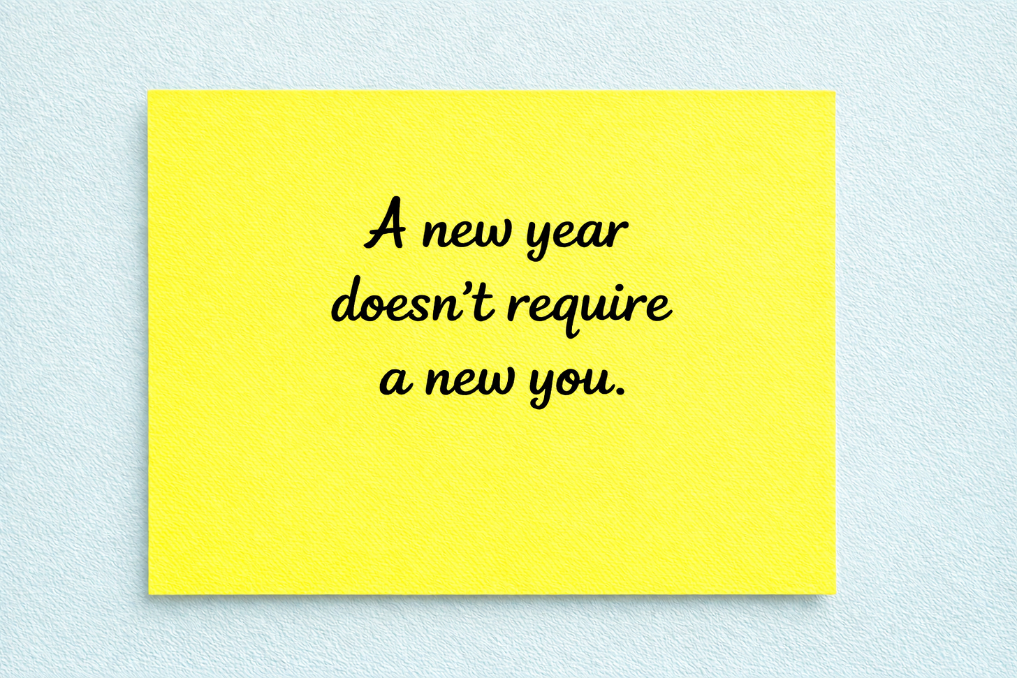 Sticky note with the text “A new year doesn’t require a new you.”