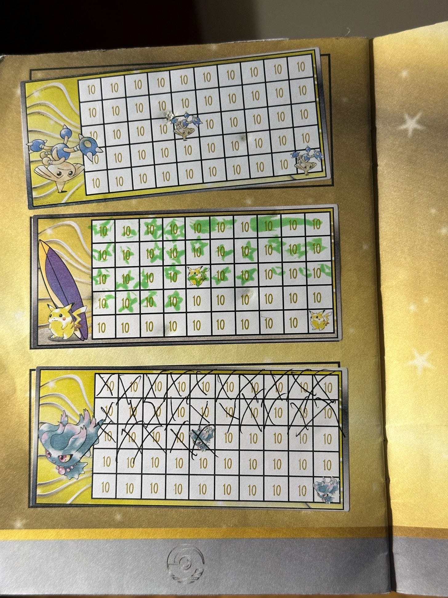 Inside Greg's badge book, showing progress towards obtaining promo cards Hitmontop, Surfing Pikachu, and Misdreavus Inside Greg's badge book, showing progress towards obtaining promo cards Hitmontop, Surfing Pikachu, and Misdreavus