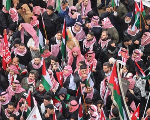 Jordanians wave the national flag and shout anti displacing Palestinian slogans during a protest in February 2025. Jordanians wave the national flag and shout anti displacing Palestinian slogans during a protest in February 2025.