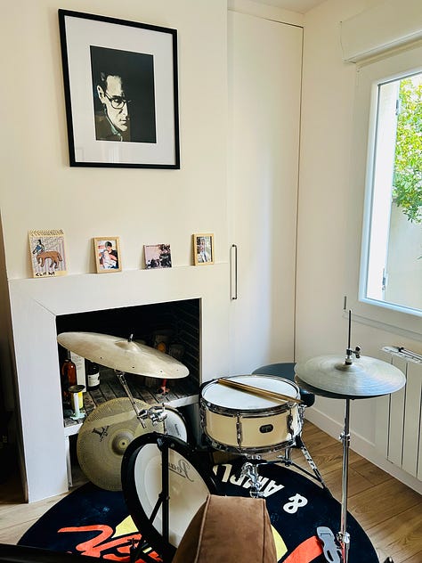 Pictures of Parisian musicians playing base, saxophone, drums, guitar and trombone at their practice session in Paris