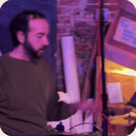 King Klave, Amaury Acosta, drumming live at his Klave Station setup in a brick-walled room.