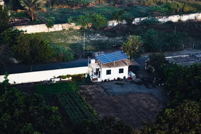 https://unsplash.com/photos/an-aerial-view-of-a-house-with-a-solar-panel-on-the-roof-tC4tHCeoO44