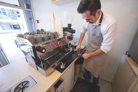Frank Hsu of Frank's Coffee - behind the coffee machine at Frank's Coffee The Terrace.